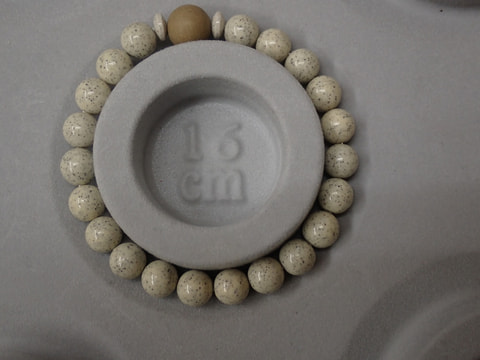 210番　８ｍｍブレスレット（玉川産北投石天然色10ｍｍ、台湾産北投石、ボタン）　写真画像