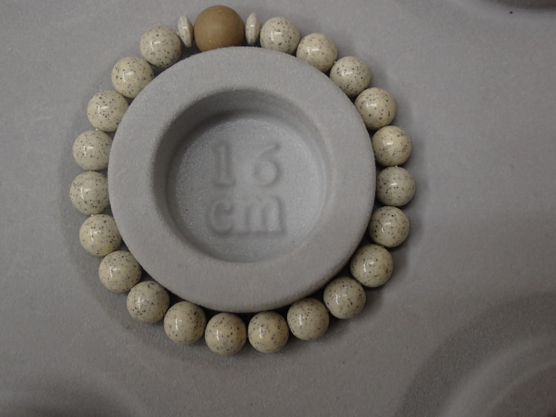 210番　８ｍｍブレスレット（玉川産北投石天然色10ｍｍ、台湾産北投石、ボタン）　写真画像